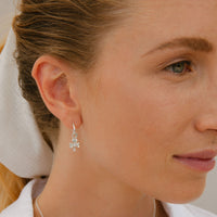 Tiny Cupid Hoops With Baby Shamrock Charms
